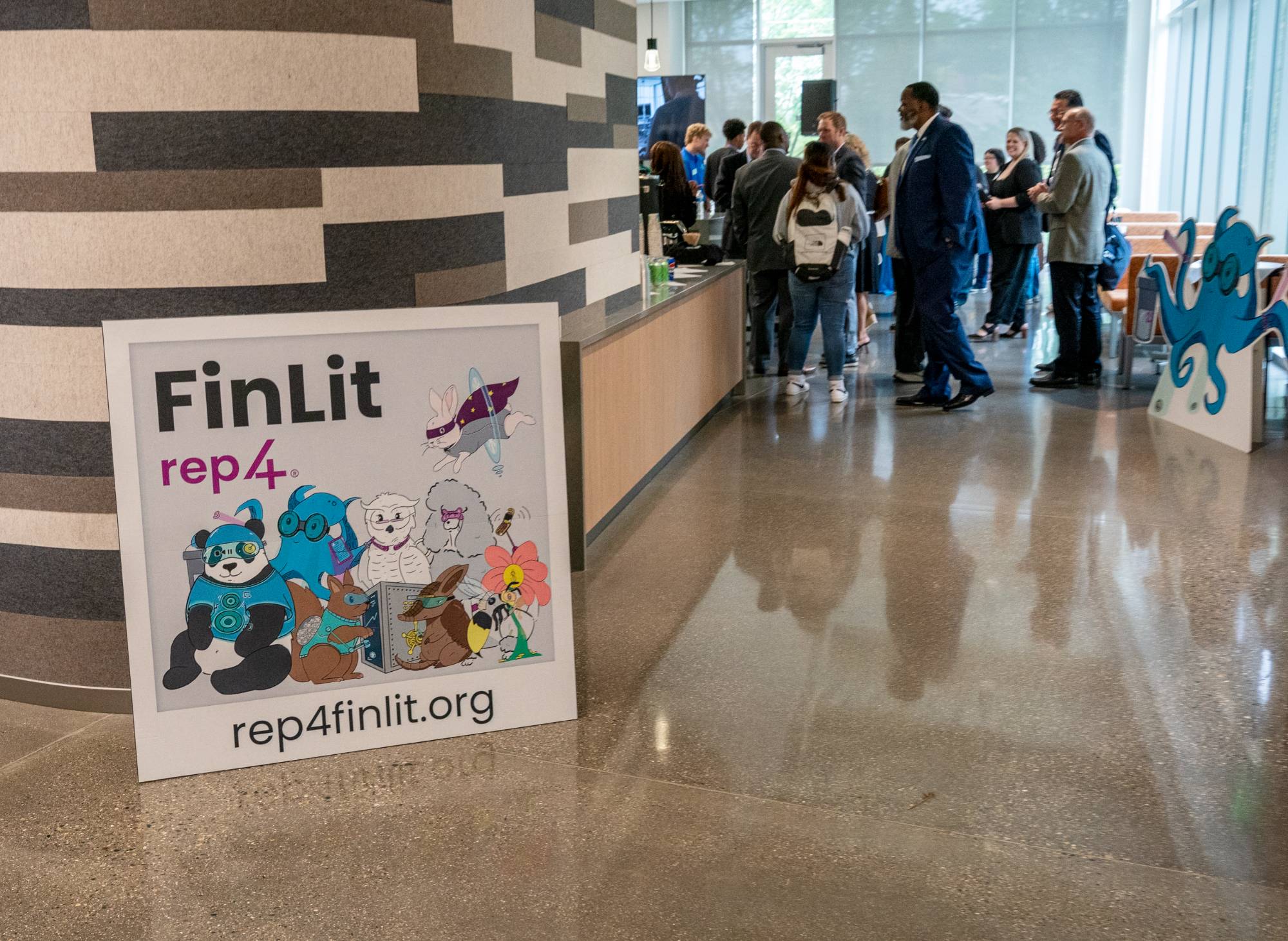 A focus shot of aREP4(R)FinLit polaroid at the launch event. It showcases all 8 animal personalities.